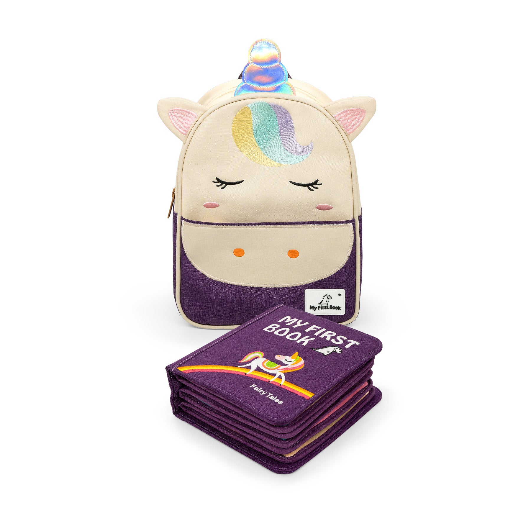 Märchenwelten Set: beige-lila Einhorn-Rucksack mit dem geschlossenen lila Fairy-Tales-Quiet-Book davor, das die vielen dicken Stoffseiten zeigt. Ab 1 Jahr.